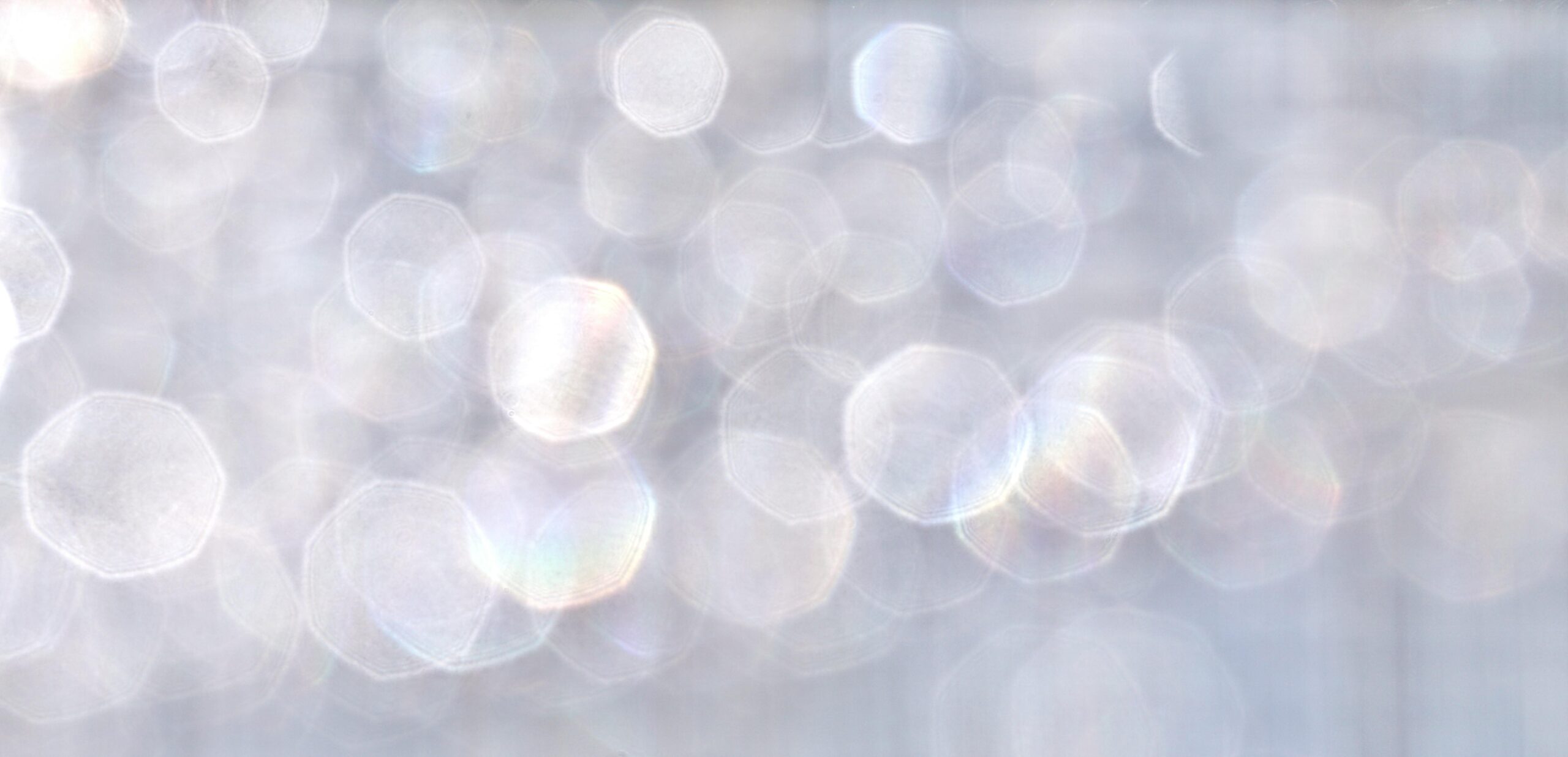 pexels-photo-12060162-12060162 Soft abstract bokeh background with shimmering light effects.